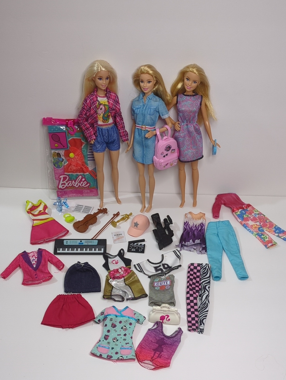 Barbie Three Doll Lot with Pink Backpack and Multicolor Outfits - Barbie